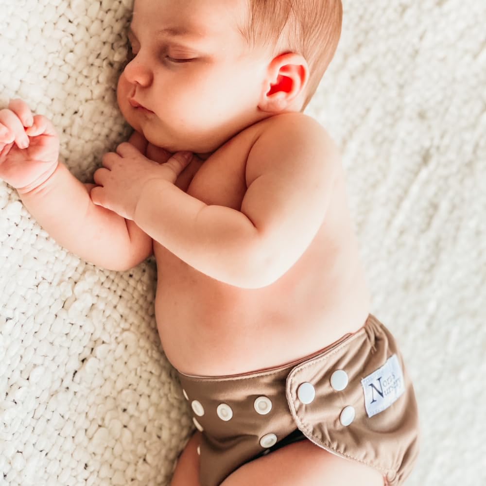 Nora's Nursery evergreen set provides a coordinated, ready-to-wear option for newborn outfits.