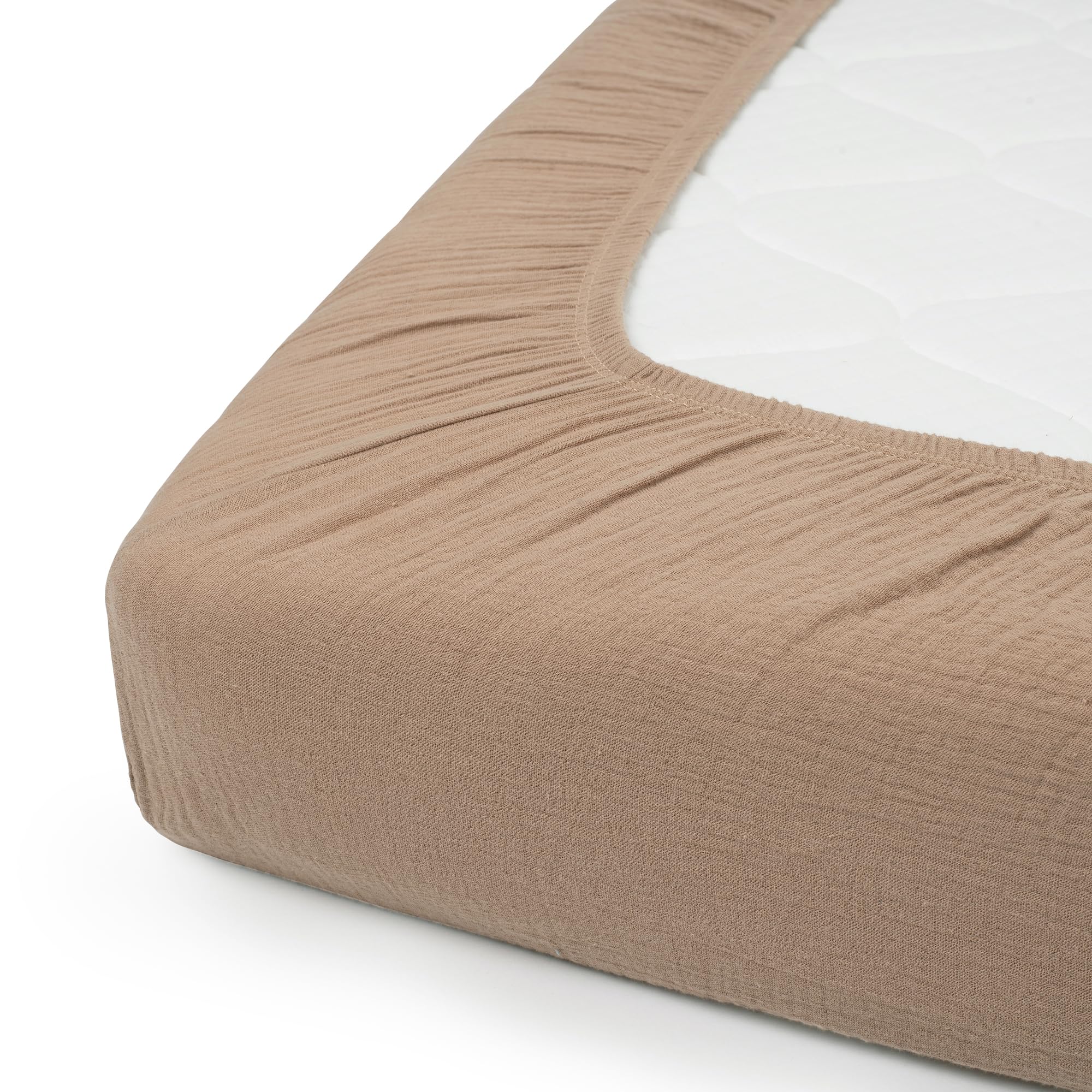 Nora's Nursery fitted sheet shows secure 4-9 inch depth fit for a snug crib.