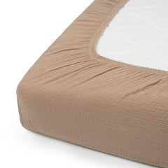 Nora's Nursery fitted sheet shows secure 4-9 inch depth fit for a snug crib.