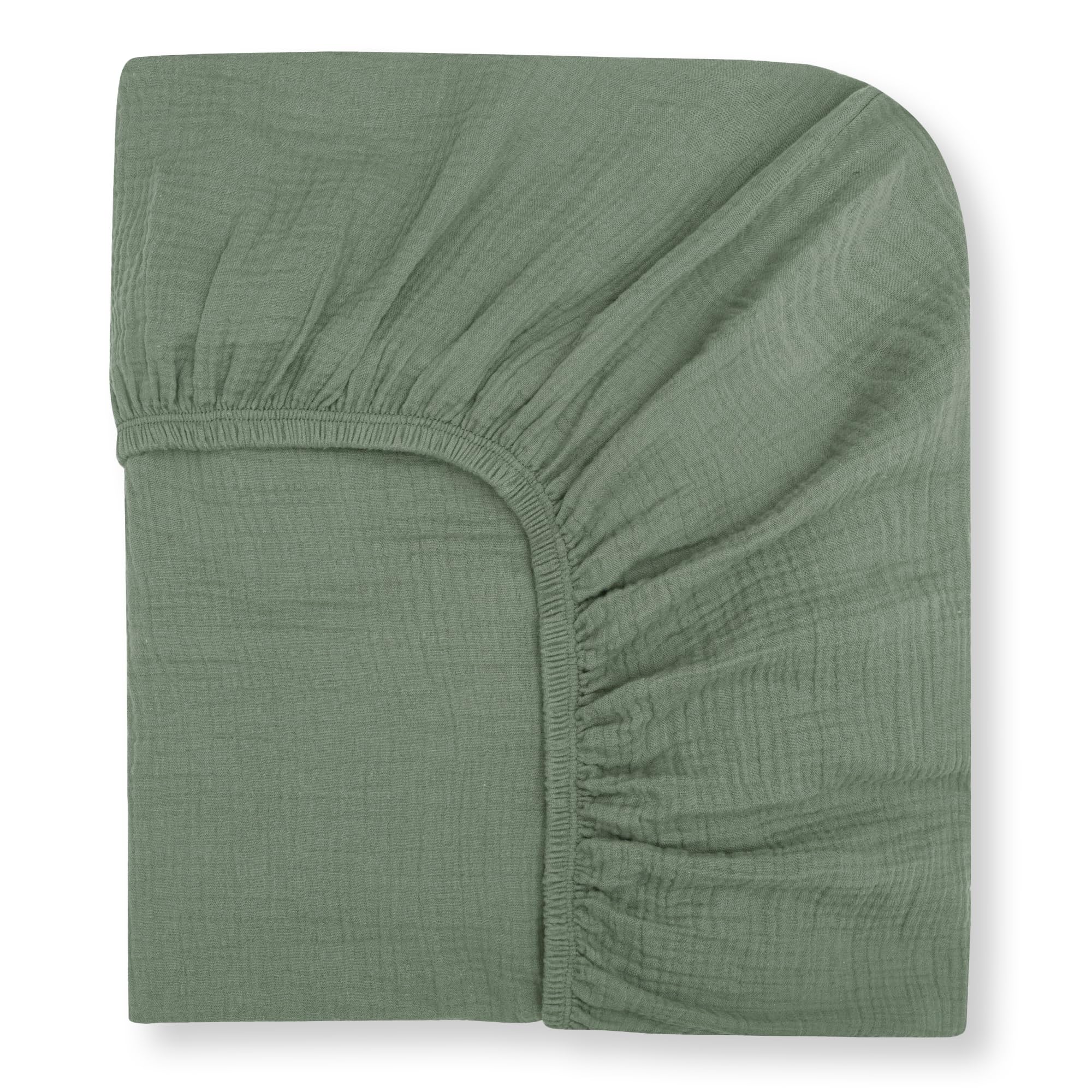 Nora's Nursery muslin crib sheets in sage—soft close-up highlighting breathable organic cotton texture.