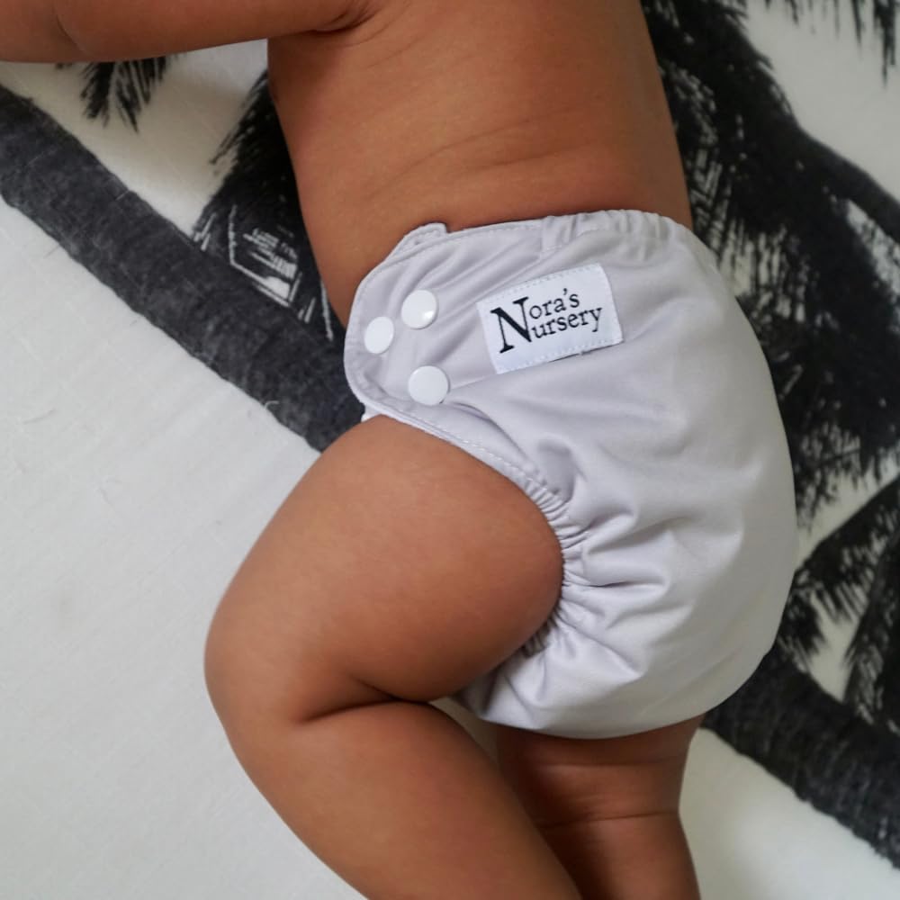 Nora's Nursery pod stores 10–14 newborn diapers or 7–8 pocket diapers.