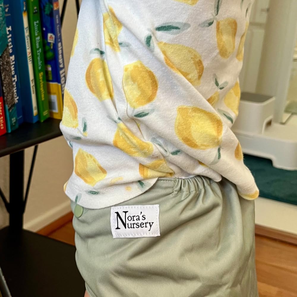 Nora's Nursery wet bag's dual zippers support organized packing and quick access.