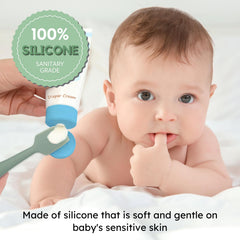 Nothomme spatula with suction base stands on a changing table for mess-free access.