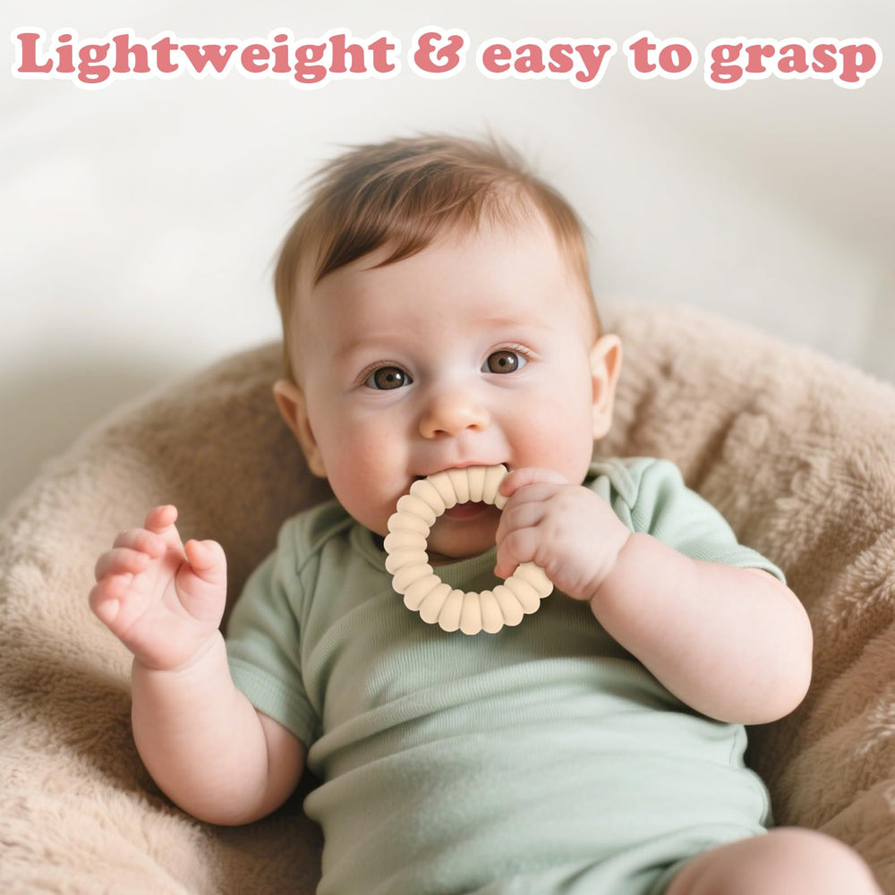 Nothomme teether rings in baby's hands demonstrate easy-to-grasp design for self-soothing.