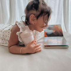 noüka insulated sippy cup shows double-wall temp control for warm or cool sips.