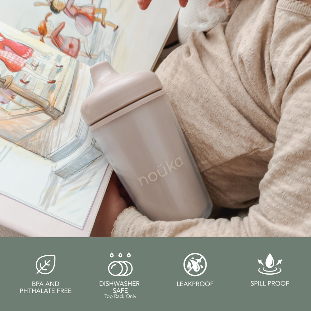 noüka insulated sippy cup with easy-grip handle for small hands.