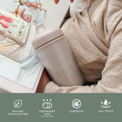 noüka insulated sippy cup with easy-grip handle for small hands.