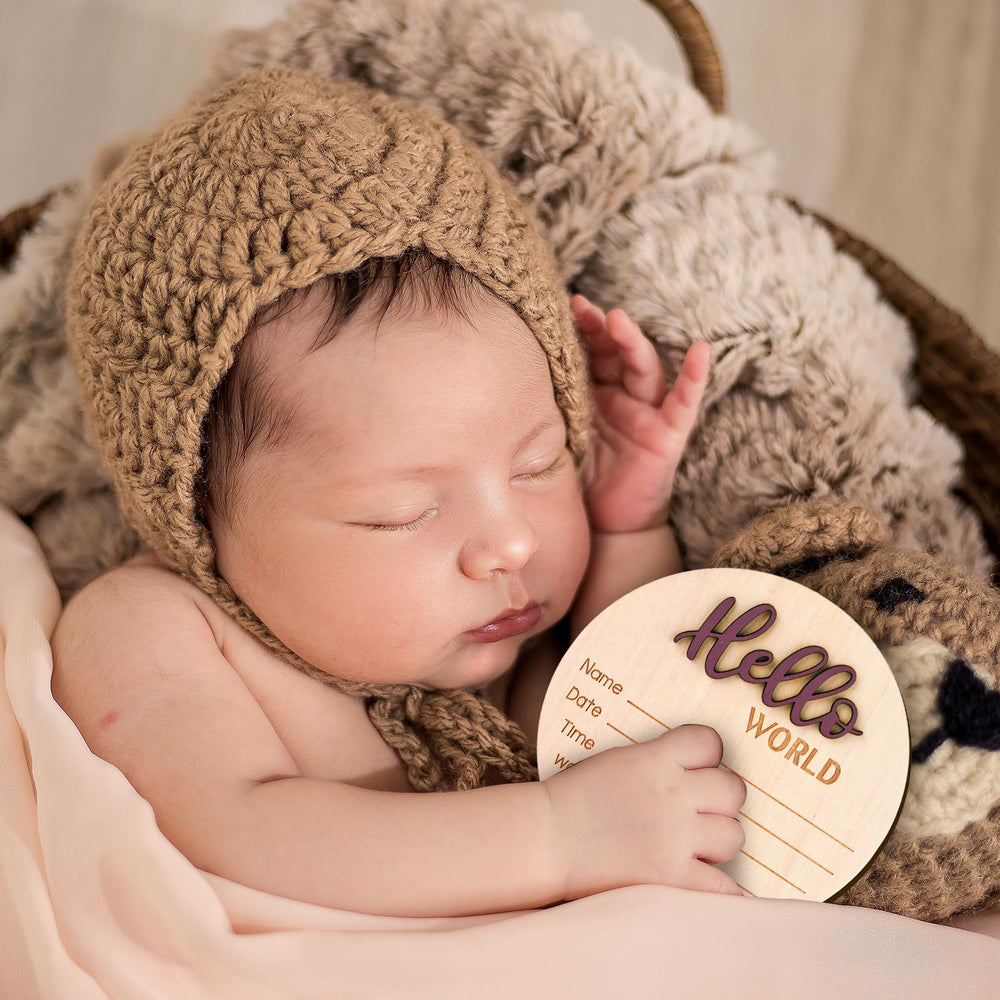 NQEUEPN sign used as a photo prop in a newborn session.