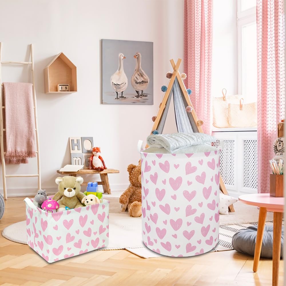 NTAOHAMPER pink heart laundry basket with leather handles for easy portability.