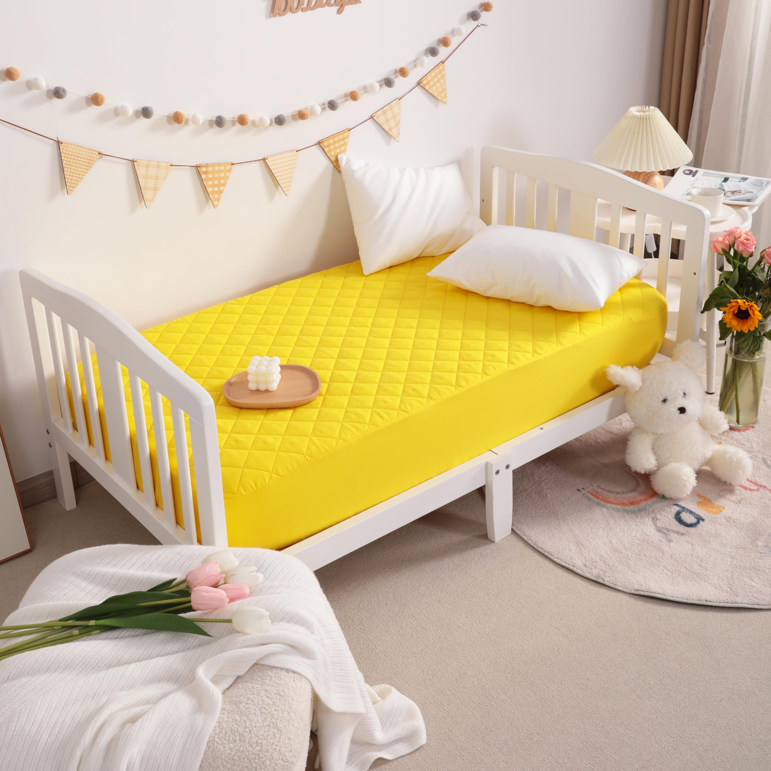 NTBAY 24x38 inch protector fits securely on mini cribs.