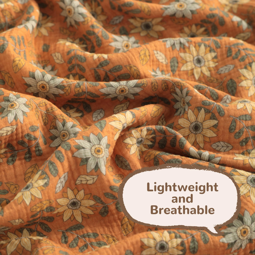 NTBAY 42x60 blanket folded in nursery, ideal for crib or travel prep.