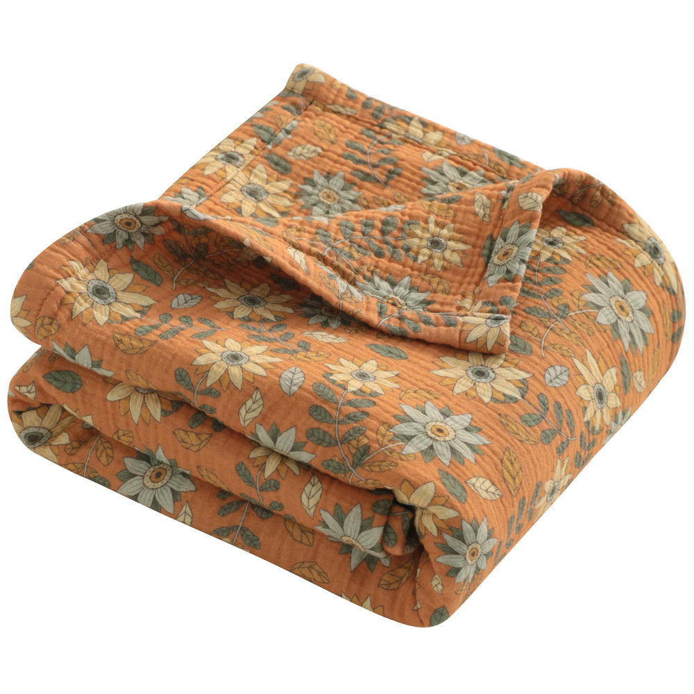 NTBAY 4-layer muslin blanket close-up fabric texture highlighting breathable comfort for babies.