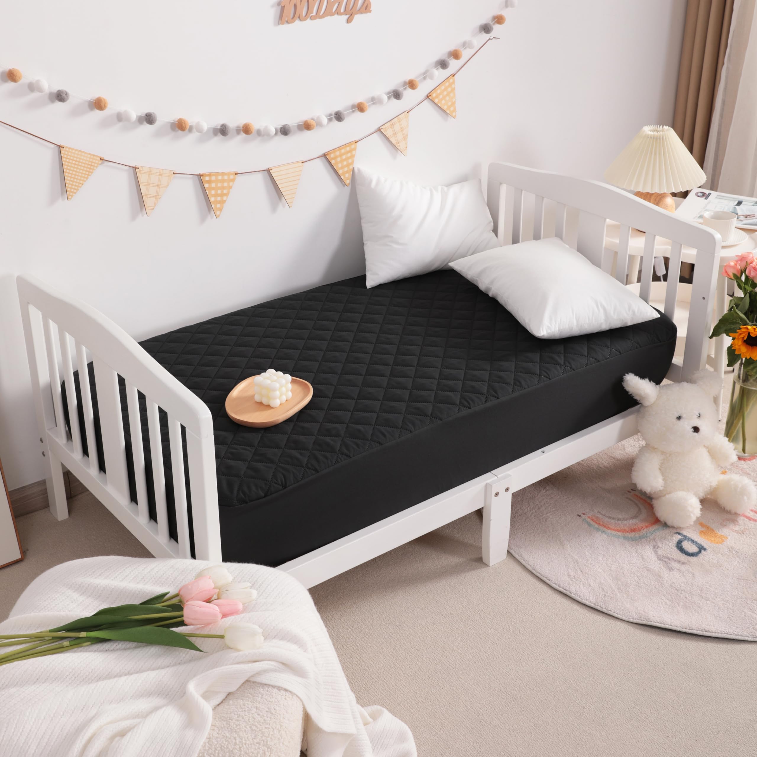 NTBAY black mini crib protector surface demonstrates durable coverage and mattress protection