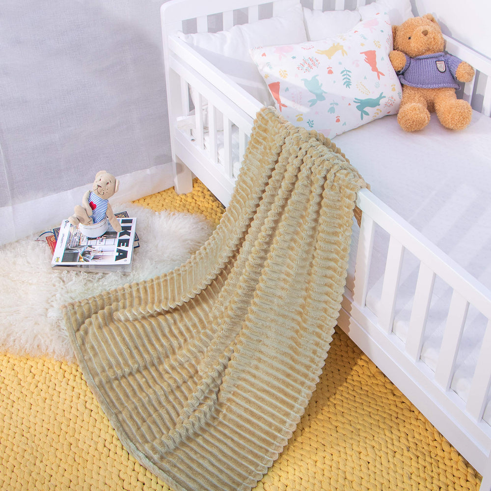 NTBAY flannel toddler blanket on a stroller cover demonstrates portability