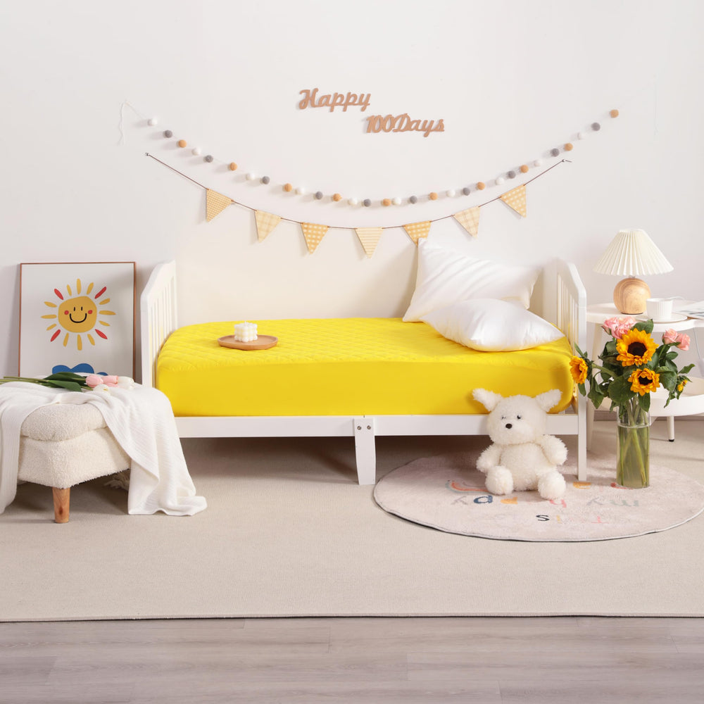 NTBAY machine washable mini crib cover for easy cleanups after spills.