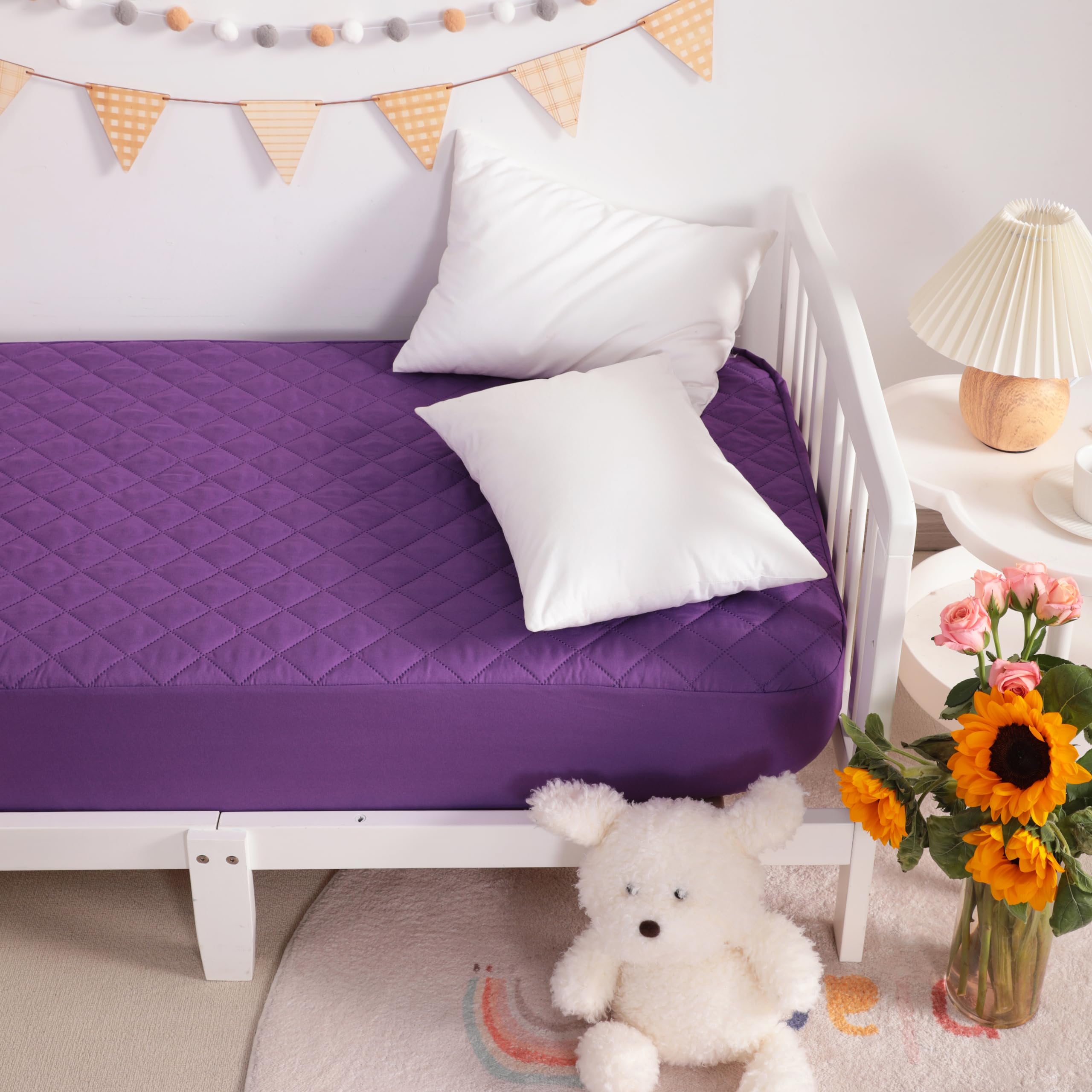 NTBAY machine-washable mini-crib protector illustrating easy care.