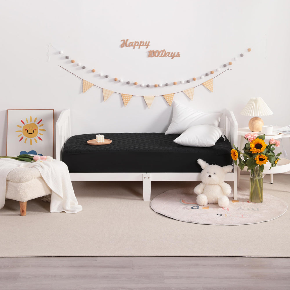 NTBAY machine-washable mini crib protector for easy cleanup