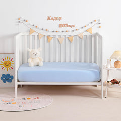 NTBAY mini-crib-sheets-aqua-folded to highlight snug fit and easy handling.