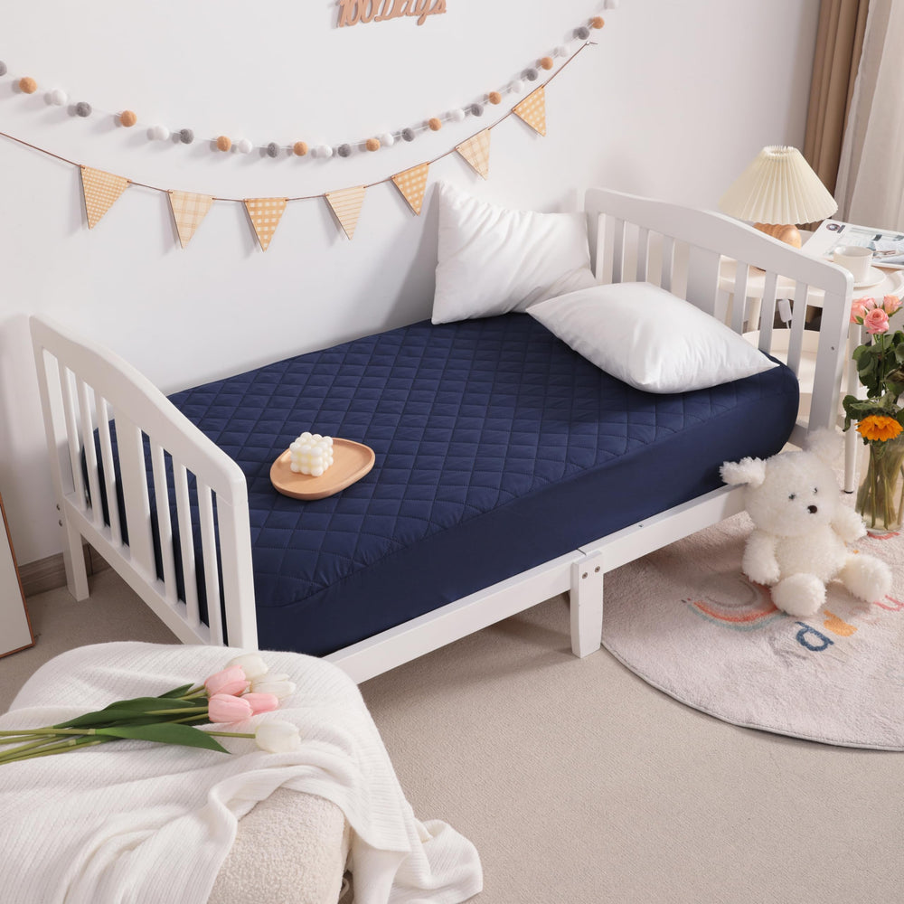 NTBAY navy protector keeps mattress feel soft while guarding against spills.