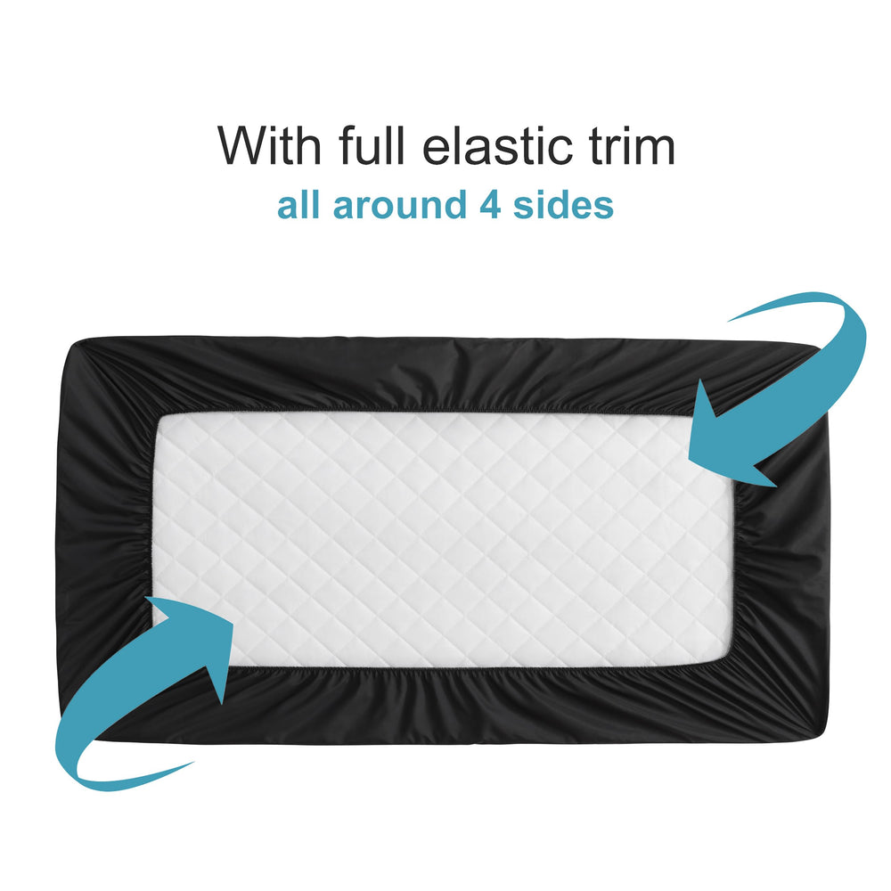 NTBAY quilted-top mini crib protector close-up highlighting soft surface and breathability