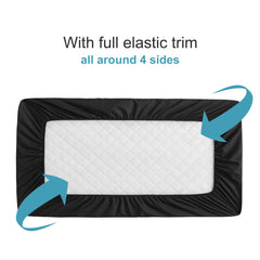 NTBAY quilted-top mini crib protector close-up highlighting soft surface and breathability