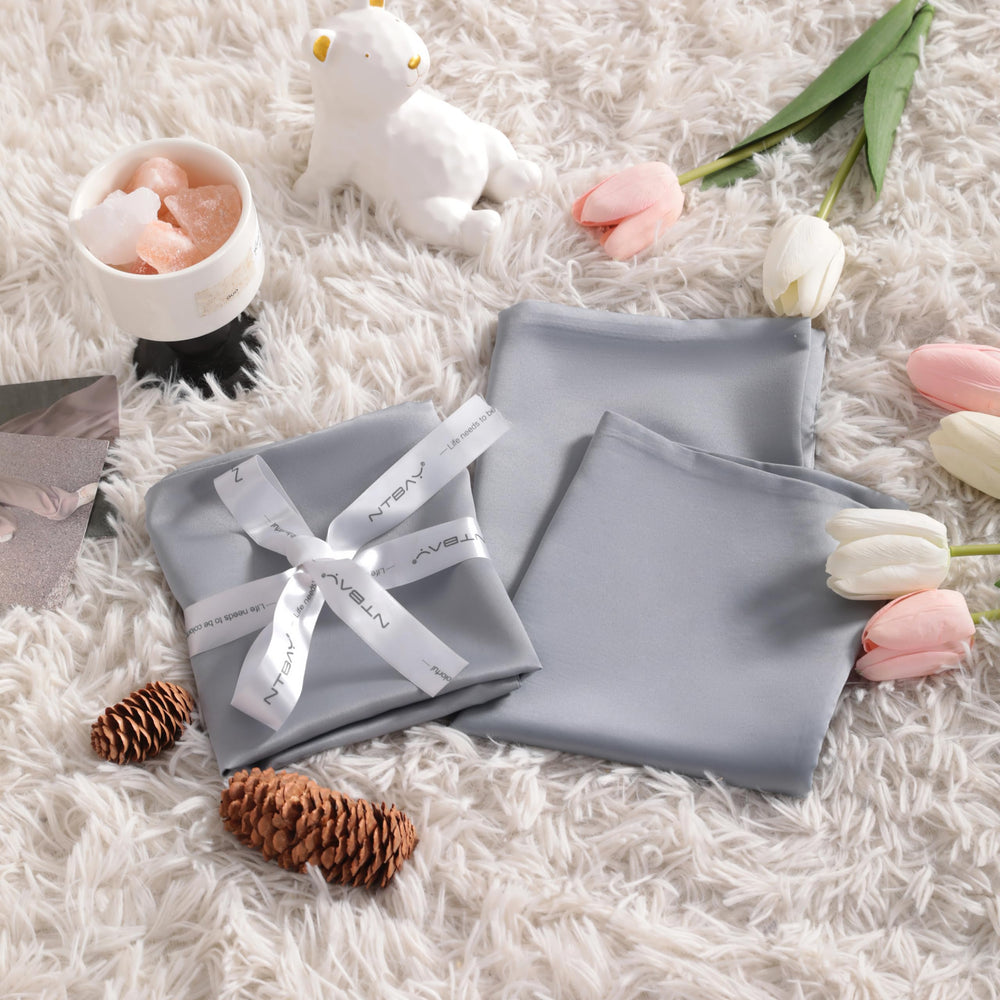 NTBAY crib décor shot showing elegant silver-grey pillowcase styling