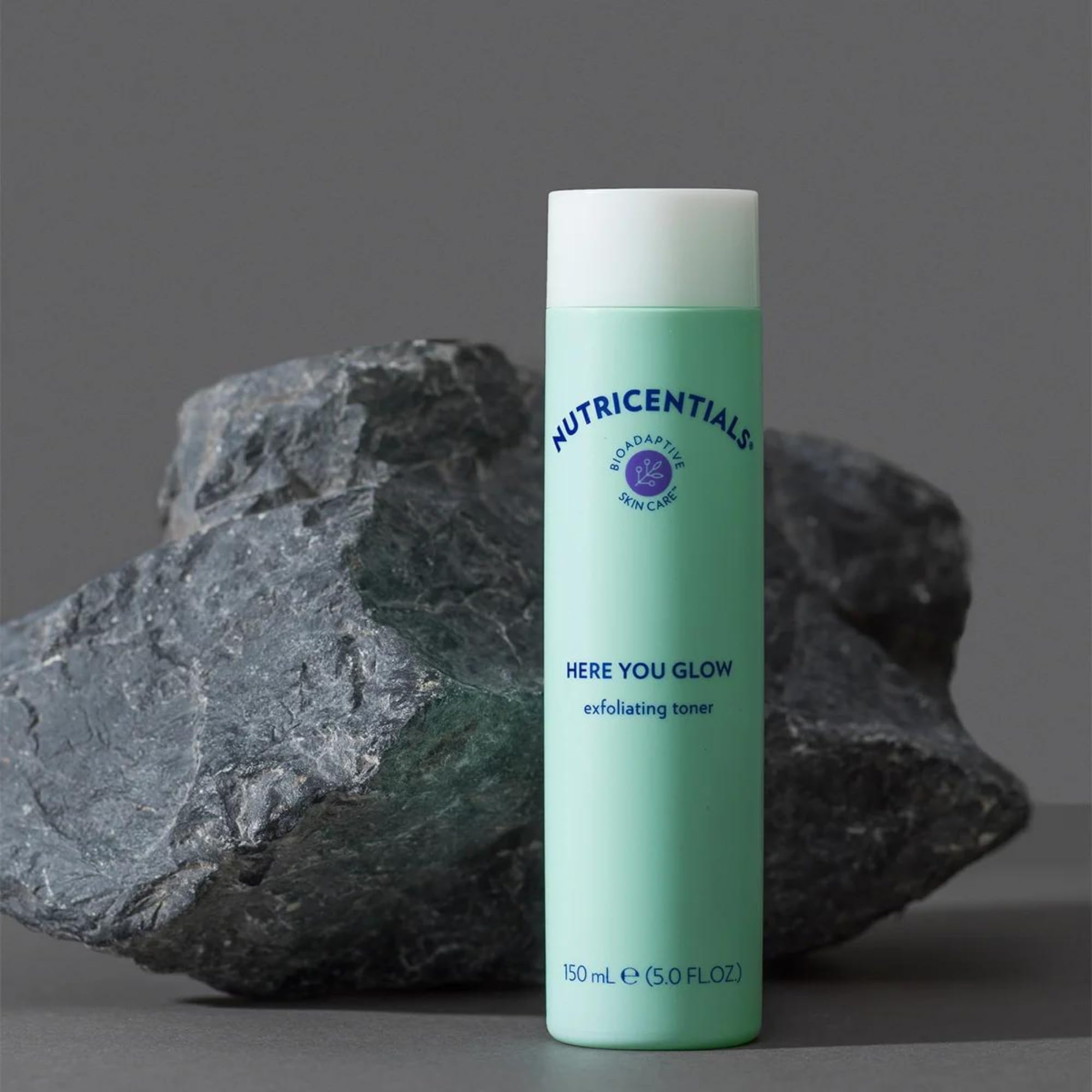Nu Skin Here You Glow toner label highlights 10% acid blend.