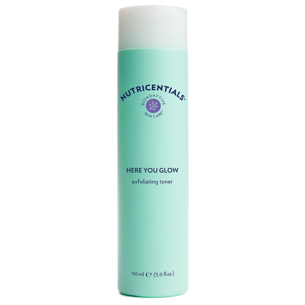 Nu Skin Here You Glow toner bottle demonstrates gentle exfoliation.