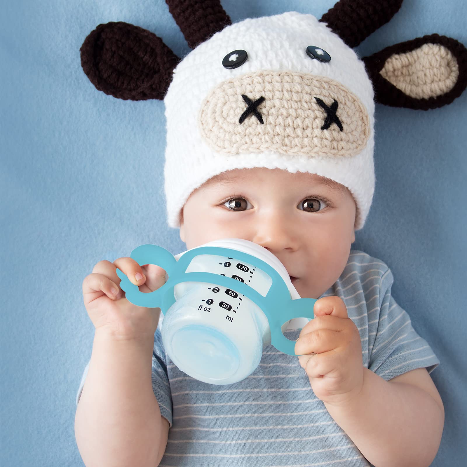 Nuanchu baby bottle handles pack display demonstrates colorful feeding accessory