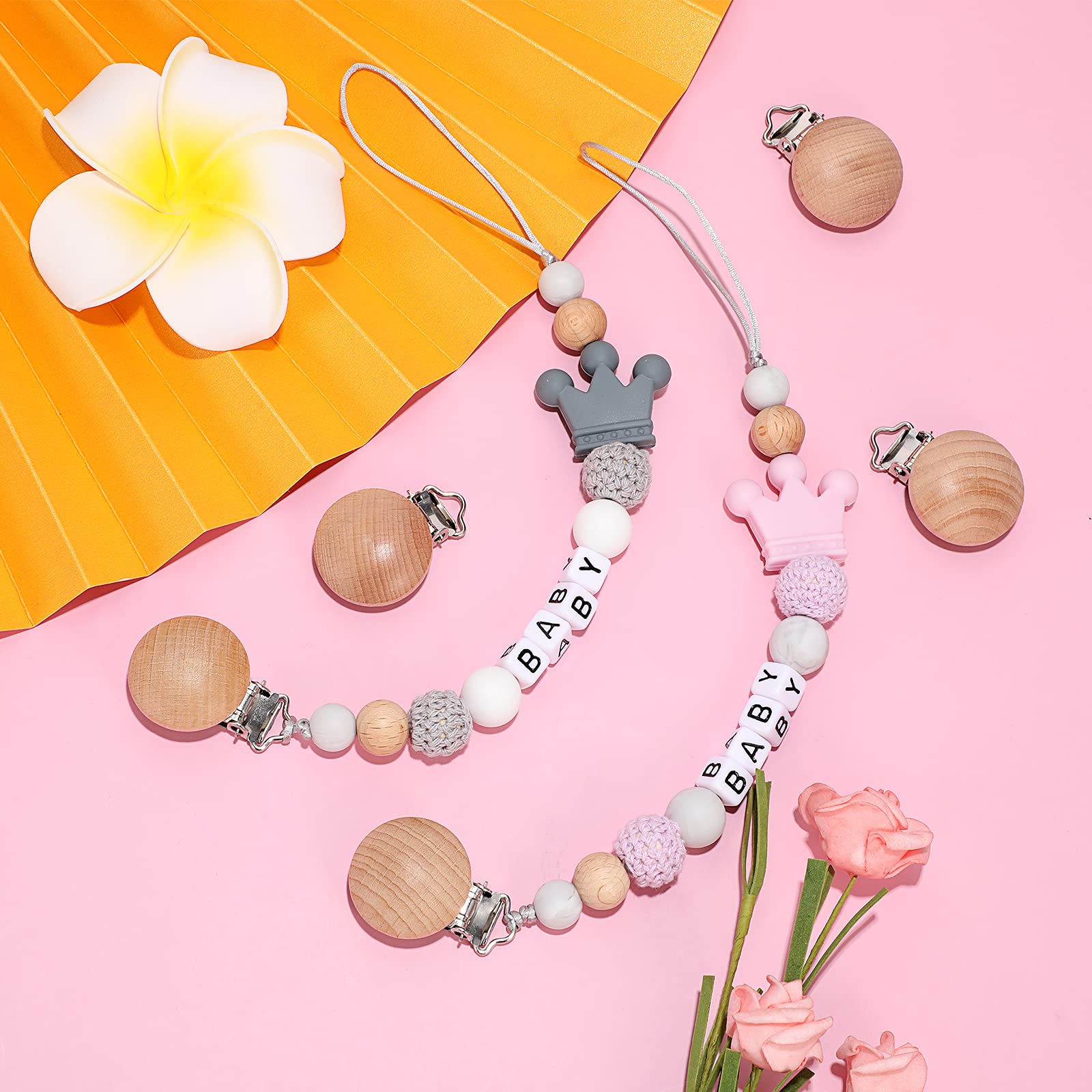 Nuanchu clip attached to teether demonstrates practical on-the-go use.