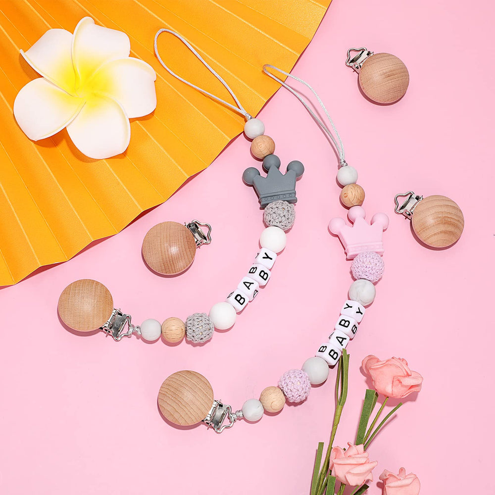Nuanchu clip attached to teether demonstrates practical on-the-go use.