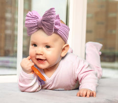NUARTNOS purple headband on a baby girl portrait demonstrates versatile accessory for photos.