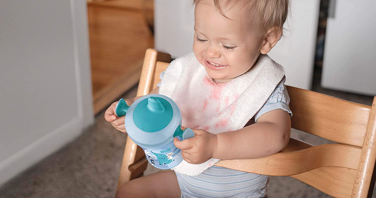 NUK Evolution Soft Spout Learner Cup interchangeable lid display for growing child.