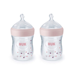 NUK Simply Natural 5oz bottle with pink hearts supports natural latch and soothing feeding.