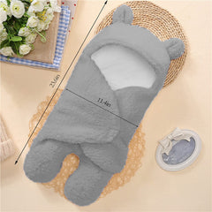 Nunibum baby swaddle blanket gray wrapped around a newborn for secure wrap