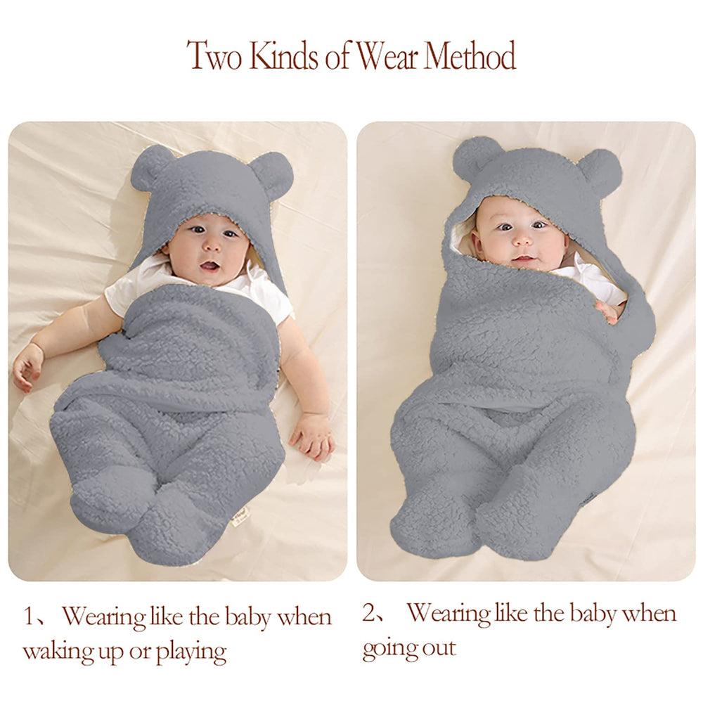 Nunibum gray receiving blanket laid out as a compact newborn wrap