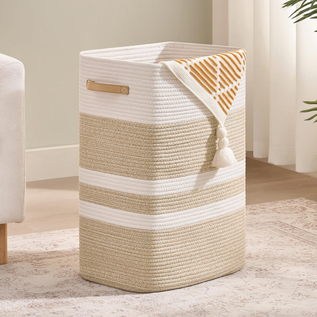 Nunsino laundry hamper front view with leather handles, stylish storage for bulky loads.