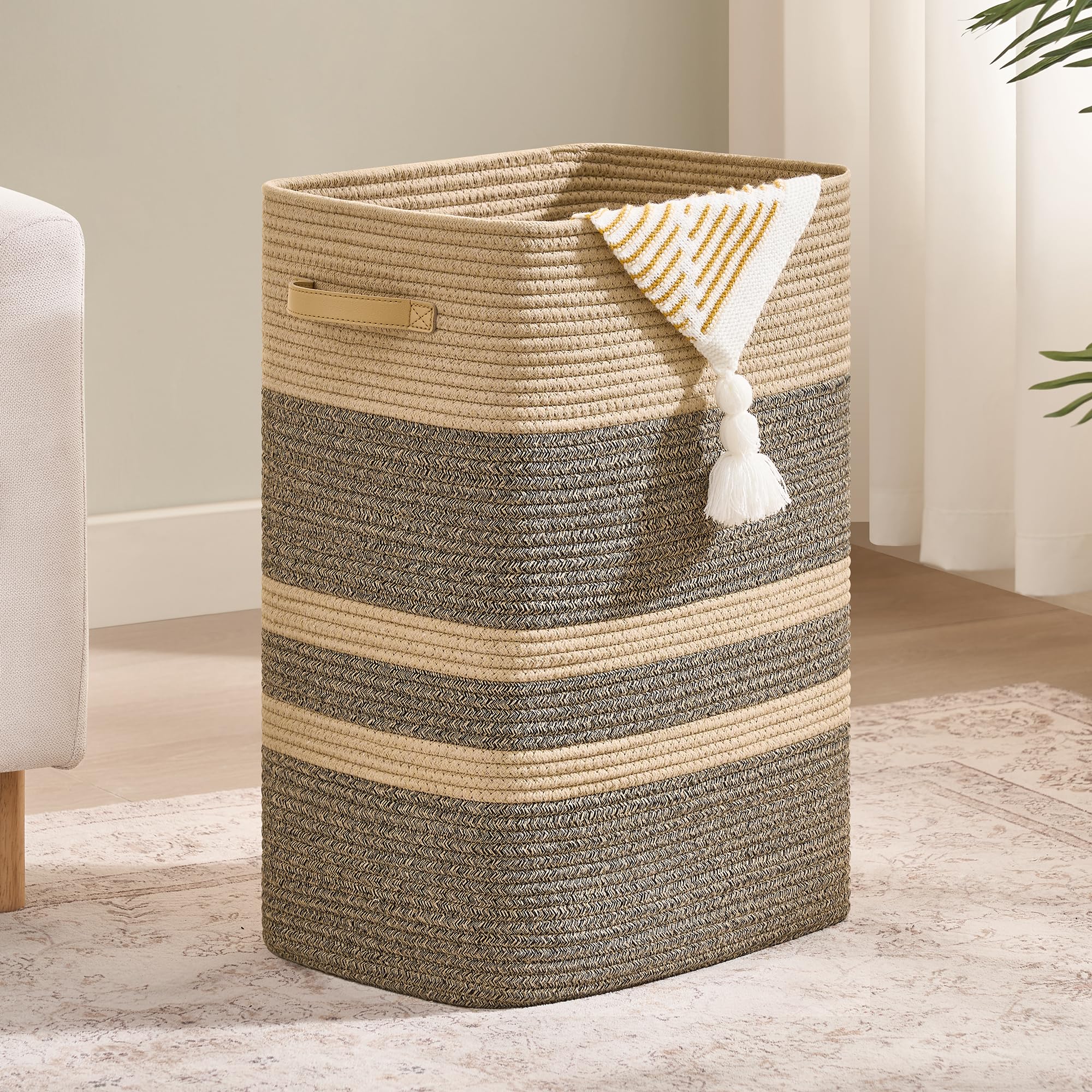 Nunsino laundry hamper leather handles for easy carrying.