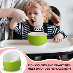 Nuogo toddler bowls shown in bright colors with silicone sleeves for easy grip.