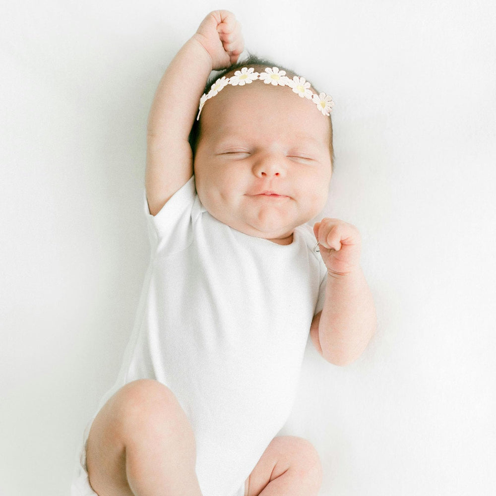 NUOSYI daisy headband yellow-white close-up showing soft fabric