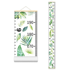 Nustila growth chart in kids room with beige frame for milestone tracking.
