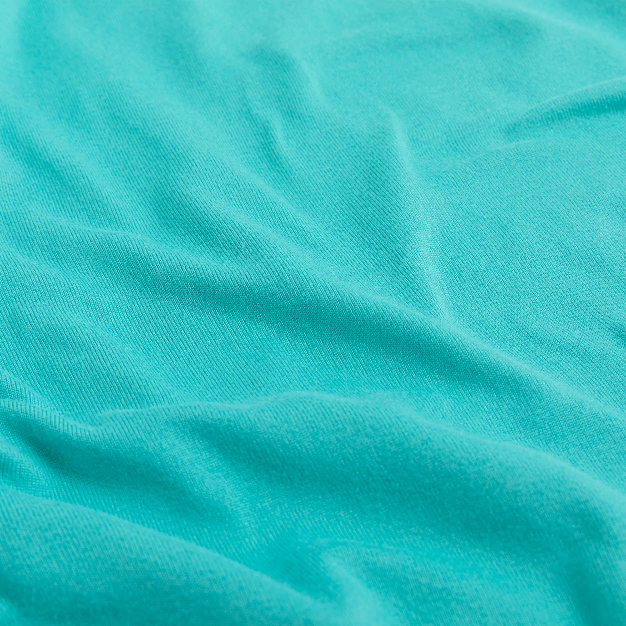 N&Y HOME jersey-knit 13x18 aqua pillowcase demonstrates secure fit with 4-way stretch for toddlers.