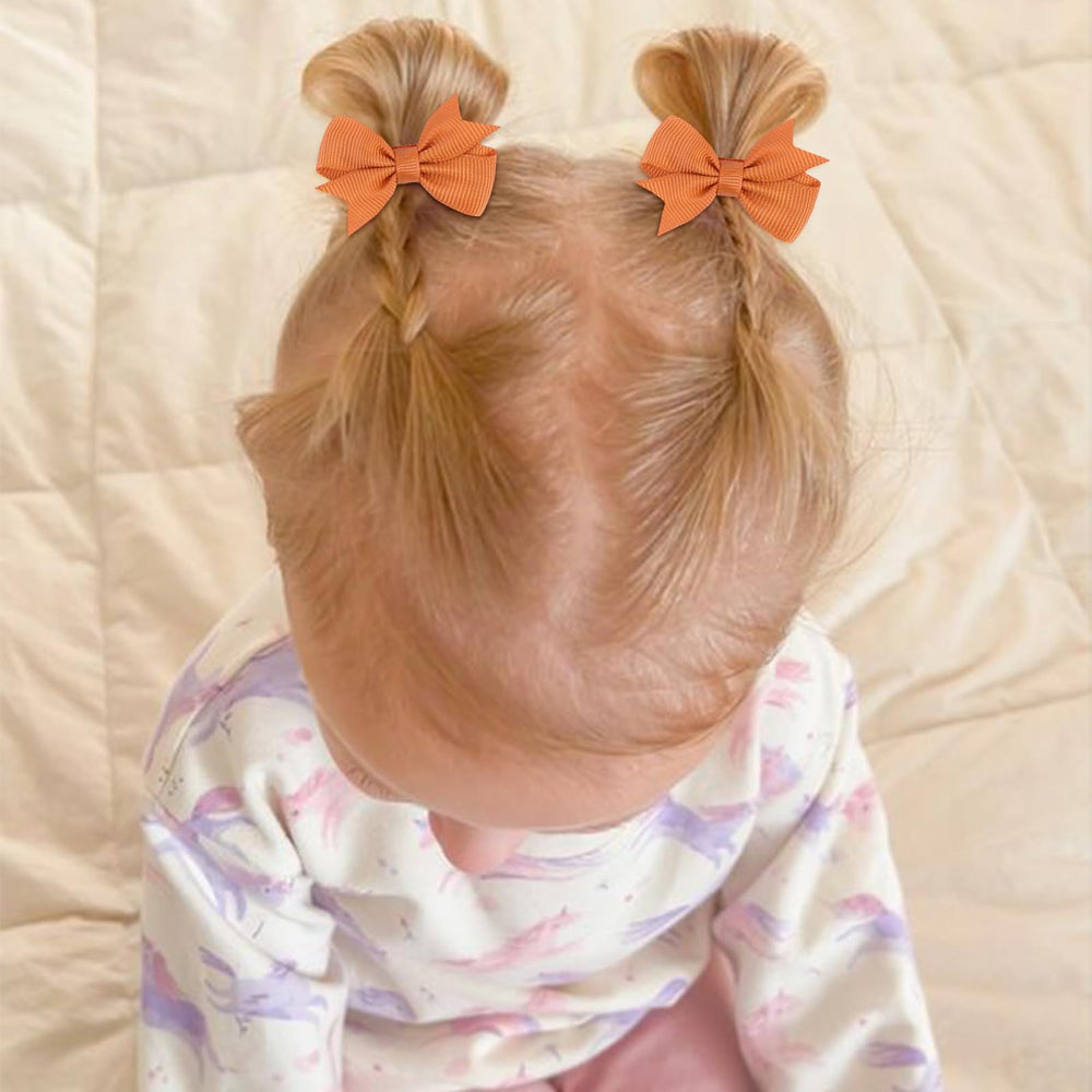 OAOLEER tiny bows alligator clip closeup showing secure, gentle grip for delicate hair