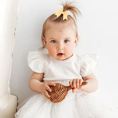 OAOLEER mini 2-inch bows on elastic ties add soft color to tiny hairstyles.