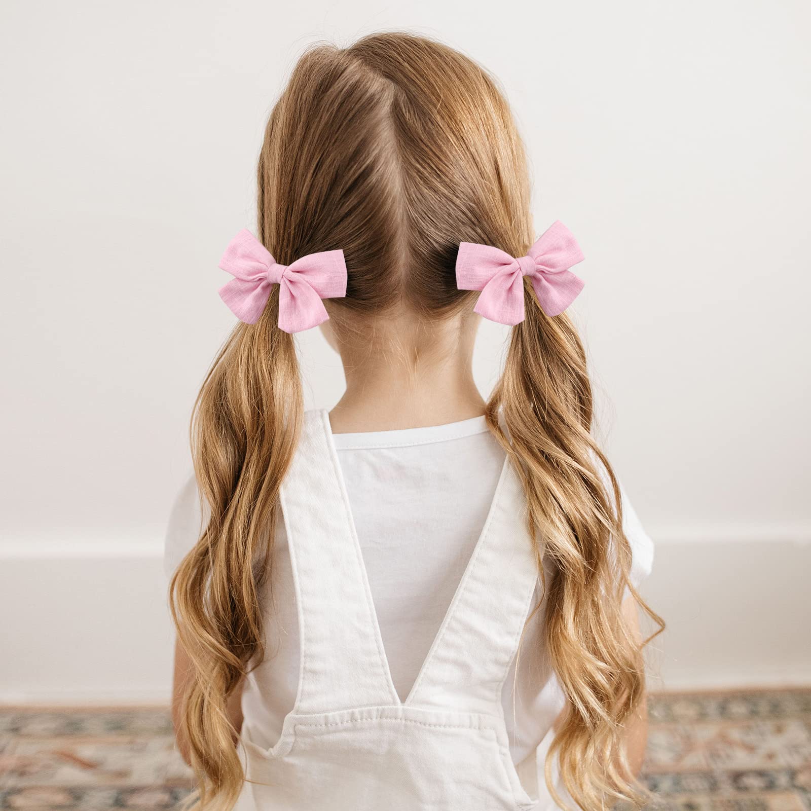 OAOLEER linen bows accent twin buns with non-slip clips.