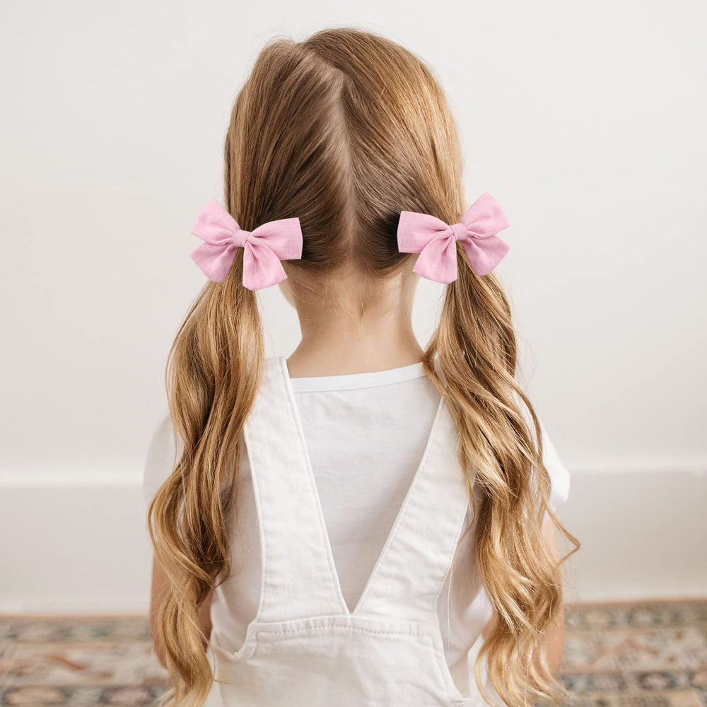 OAOLEER linen bows accent twin buns with non-slip clips.