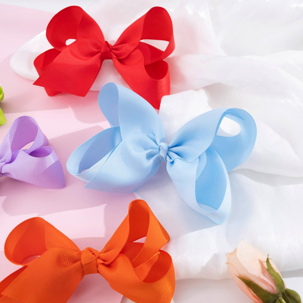 OAOLEER baby girls bows add sparkle to party or school outfits.