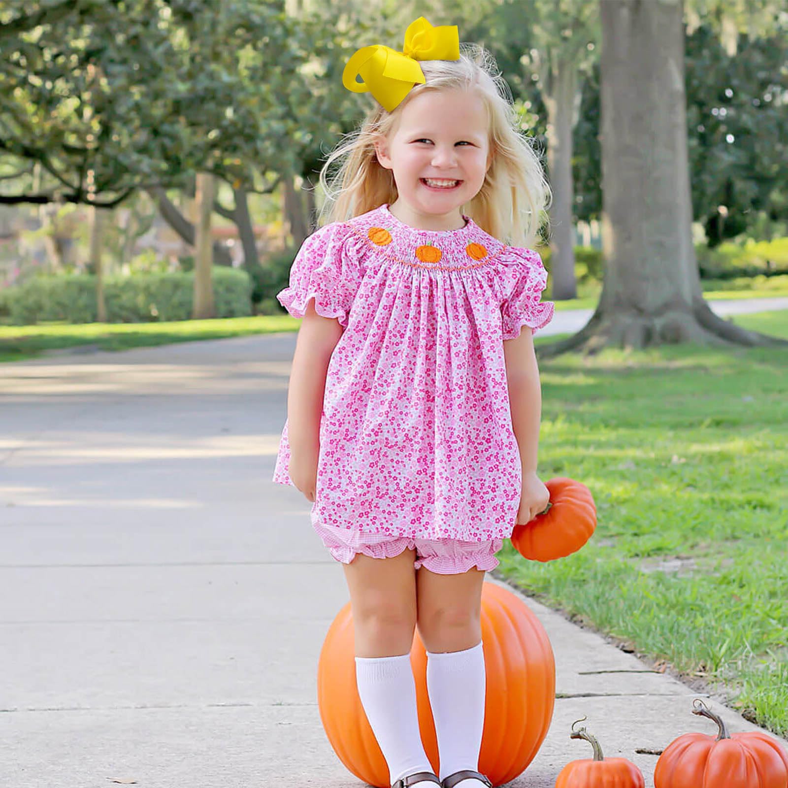 OAOLEER baby hair accessories yellow bow adds a cute outfit touch.