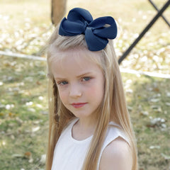 OAOLEER navy blue 4.5-inch bow clip ideal for matching outfits.