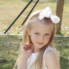OAOLEER white 4.5-inch bow shown for playful toddler styling